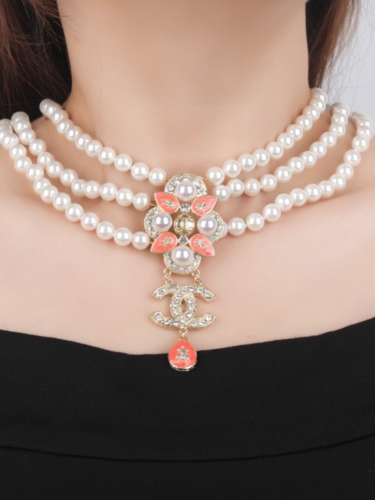 Chanel Triple-Strand Pearl Necklace With Camellia, Cc Logo, And Red Crystal Pend